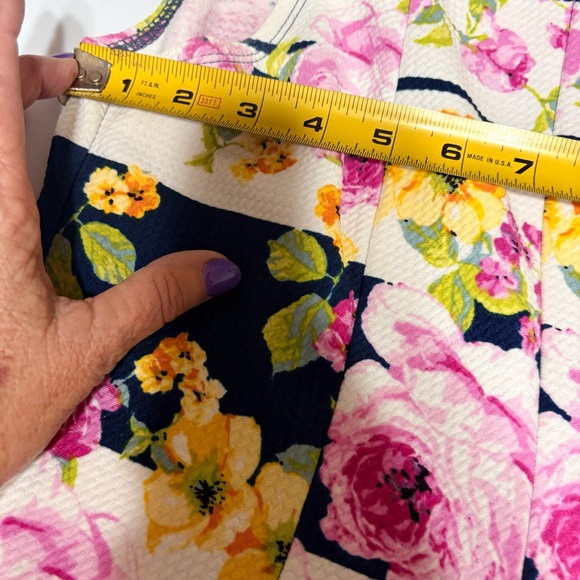 Emma & Michele floral cap-sleeve dress on a navy blue/white striped background. - Picture 8 of 12